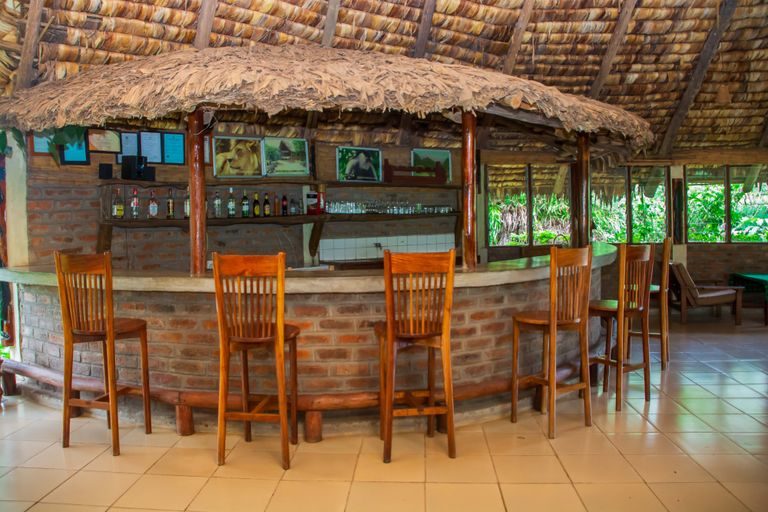 The timber bar under the thatched roof