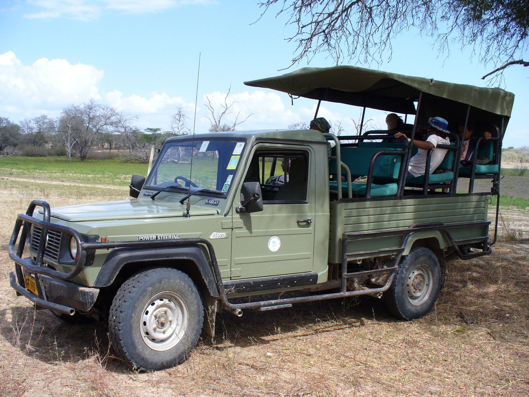 Open safari vehicle ready to leave the lodge